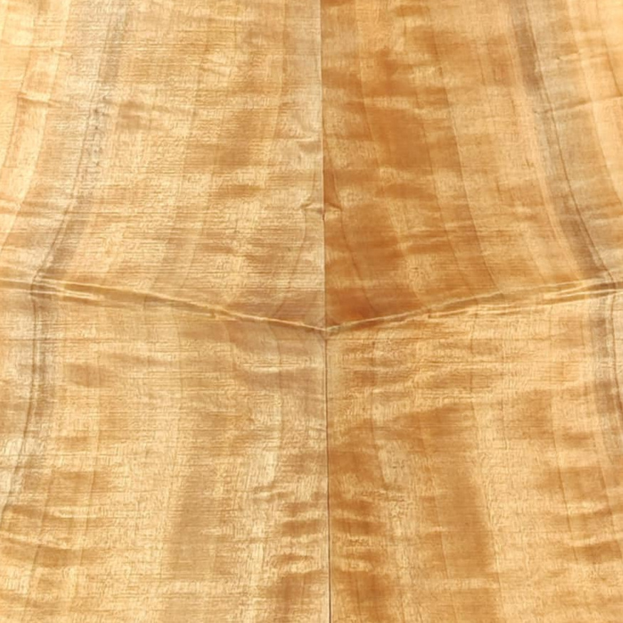A top in two book-matched halves, the grain figure mirrored across the joint